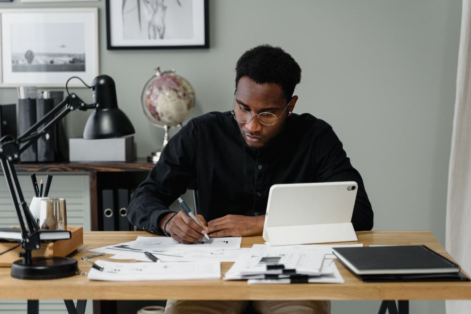 Professional working through documents at a desk